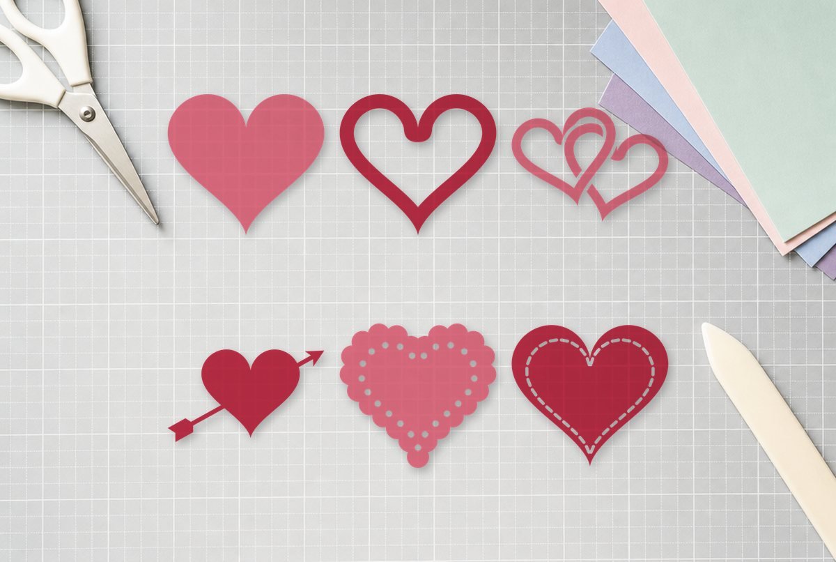 Free Heart SVG Files design cut out and laid on a cutting mat